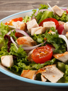 A light salad with turkey tips, tomatoes, onion, and more