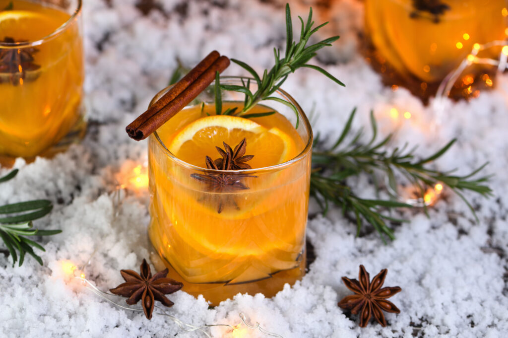 Negroni cocktail. Gin with cinnamon with oranges juice and star anise. The perfect cozy cocktail for chilly December evenings.