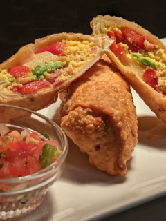 Breakfast egg rolls from Illinois chef KC Gulbro, cut open.