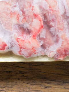 Frozen pieces of chicken still in the packaging