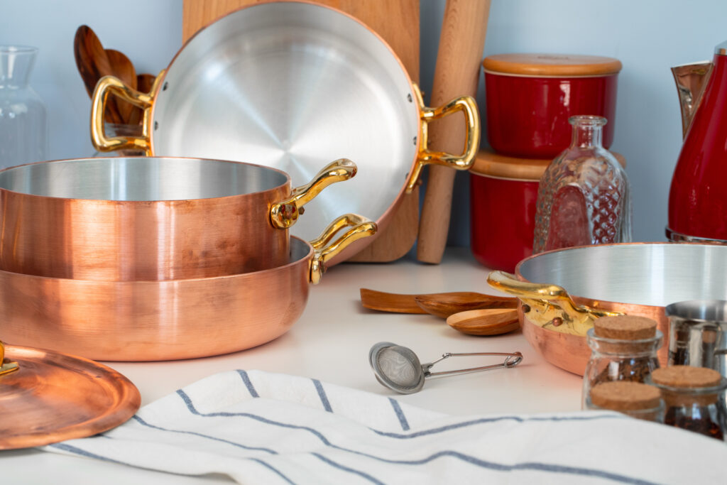 Close up of modern kitchen interior with copper cookware