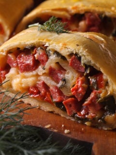 homemade strudel with ham, cheese and fresh vegetables