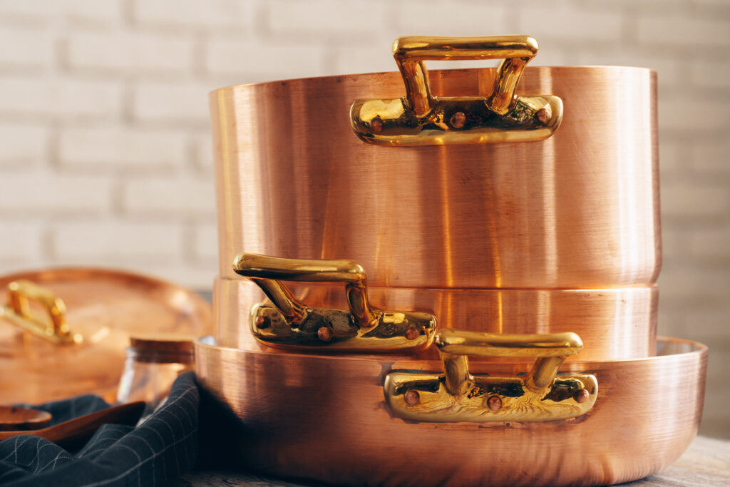 New copper cookware stacked up