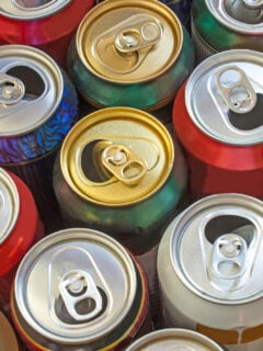Overhead view of a dozen opened cans of beer