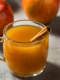 Warm Homemade Apple Cider with a Cinnamon Stick