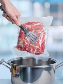 Cooking meat vacuum packed with sous vide technology.