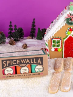 Spicewalla holiday spice pack promotional photo with gingerbread house