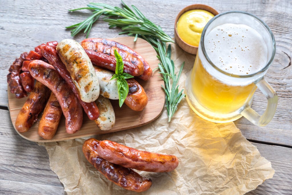 Grilled sausages with glass of beer