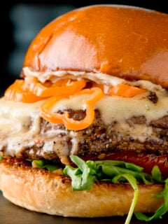 Hamburger with fried onions, grilled mushrooms and melted cheeses