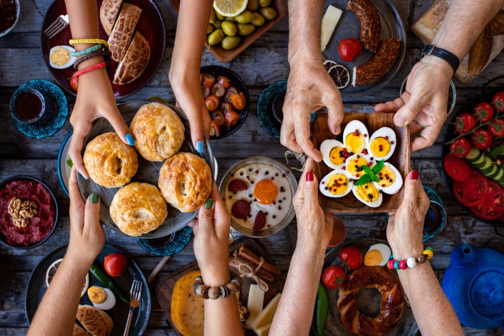 Top view of a traditional breakfast meal with friends